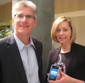 Ed O'Brien and Page Clark show off the iPhone version of WealthCentral at T3 in Weston, Fla.