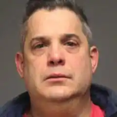 Jim Iannazzo pictured in a police mug shot, has closed the book on criminal and civil charges.