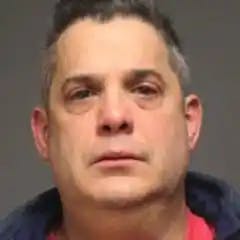 Jim Iannazzo pictured in a police mug shot, has closed the book on criminal and civil charges.