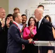 Dave Welling accepts congrats from Gov. Rick Scott in Florida for creating a mini-Silicon Valley in Jacksonville.